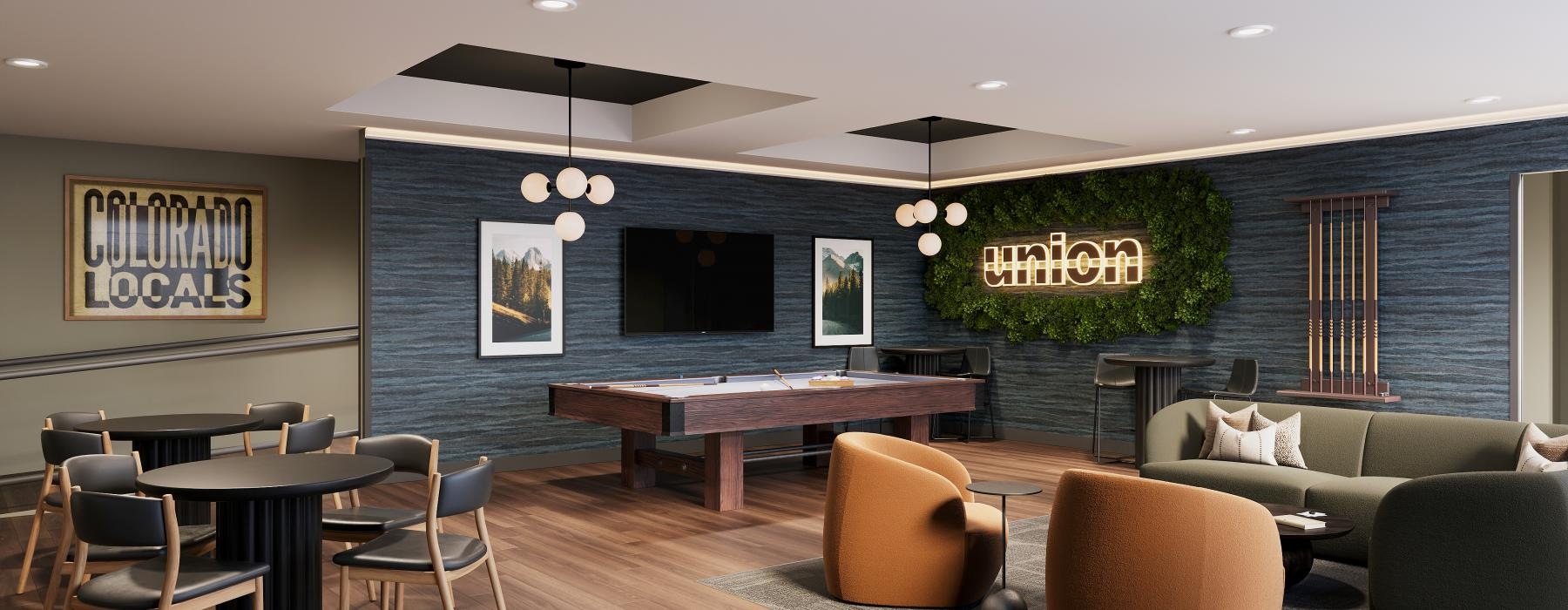 a room with a pool table chairs and a tv