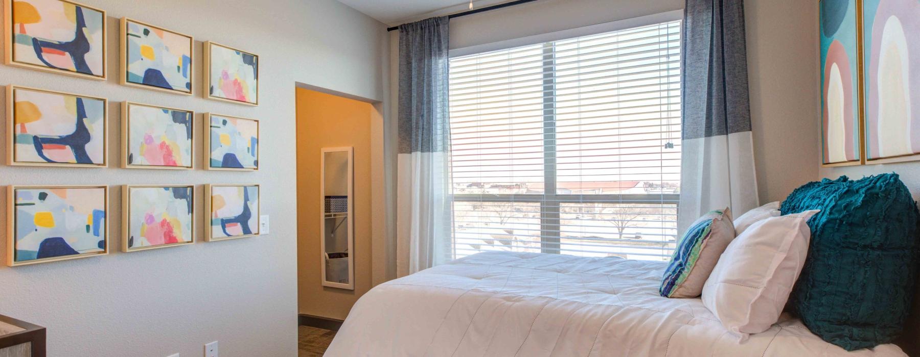 a bedroom with a bed and a fan